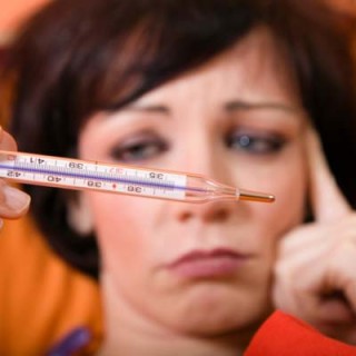 Mulher com febre - Foto Getty Images