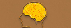 representação em desenho do cérebro pintado de amarelo