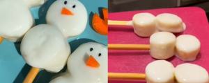 À esquerda, dois bonecos de neve de banana no palito. À direita, três bonecos de neve no palito em cima de tábua rosa